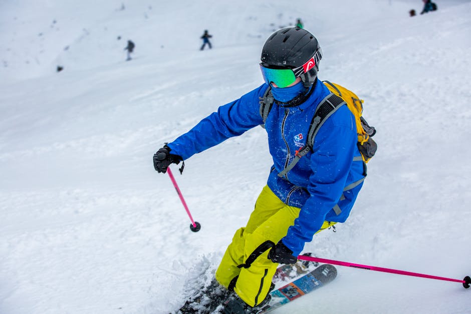 An exhilarating skier on a snowy slope in Les Contamines, France.