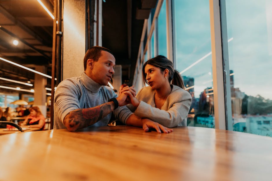 A couple shares an intimate moment at a cafe in Buenos Aires, Argentina.