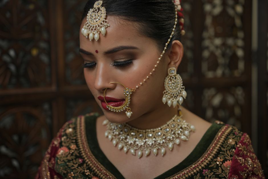Beautiful bride wearing intricate traditional jewelry and attire, exuding cultural elegance.