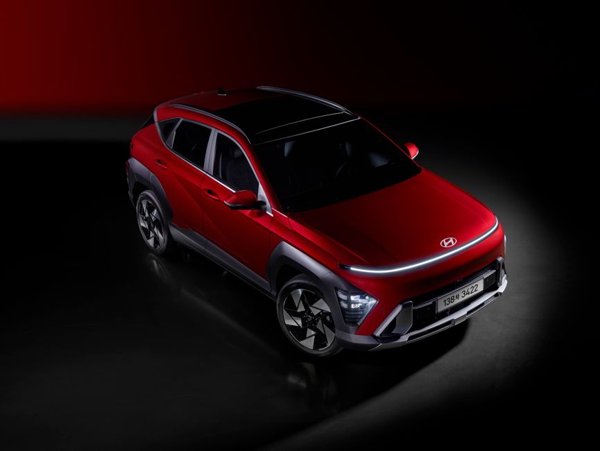 A striking red SUV with contemporary design elements and dynamic lighting, emphasizing modern automotive innovation.