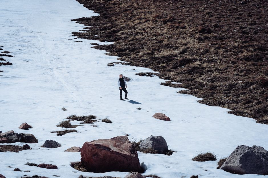Lone man walking on a snowy slope in Los Penitentes, Mendoza, Argentina.